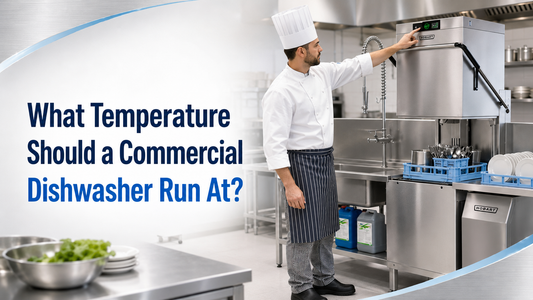 Chef checking a commercial dishwasher temperature display in a professional kitchen